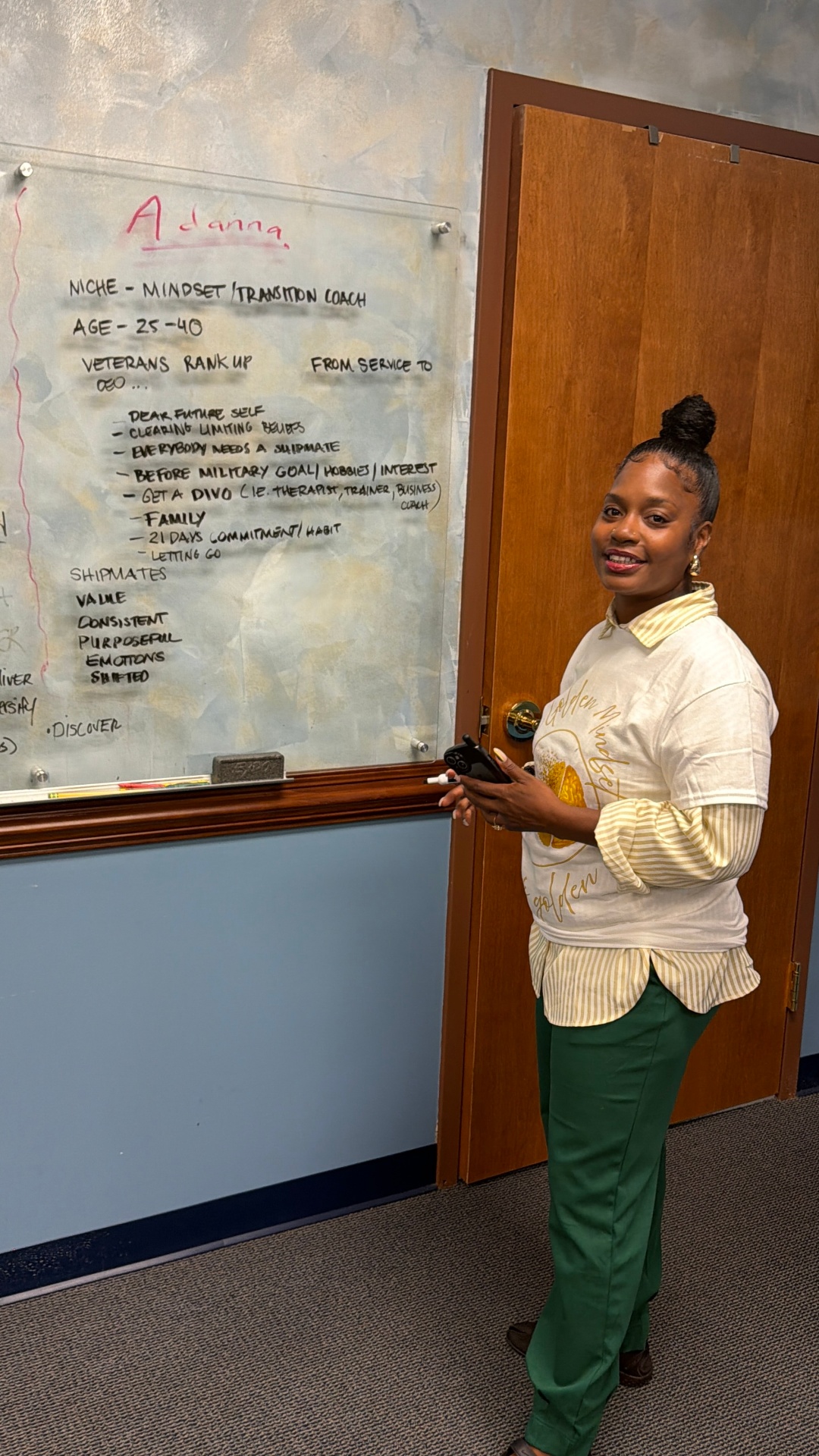 Adanna Clarke leading a mindset and transition coaching session at a whiteboard